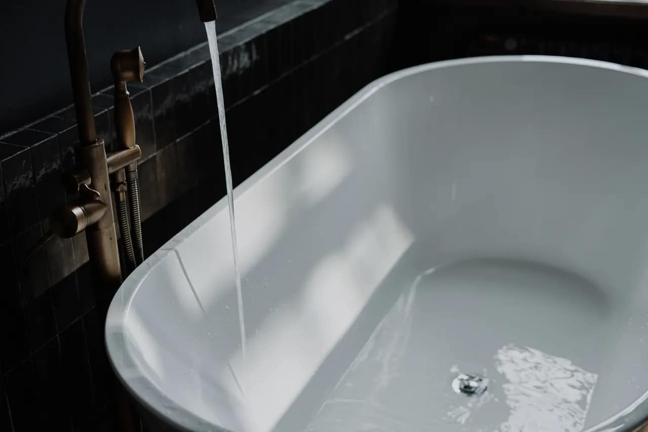 freestanding bathtub with running water