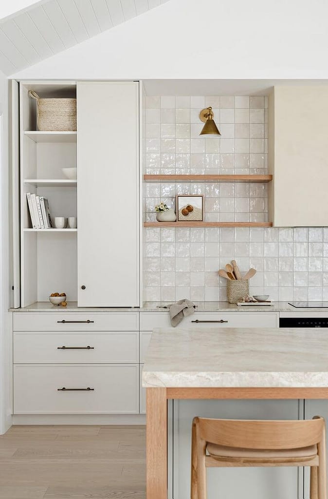 Modern kitchen renovation in West Vancouver with custom white cabinetry and marble countertops