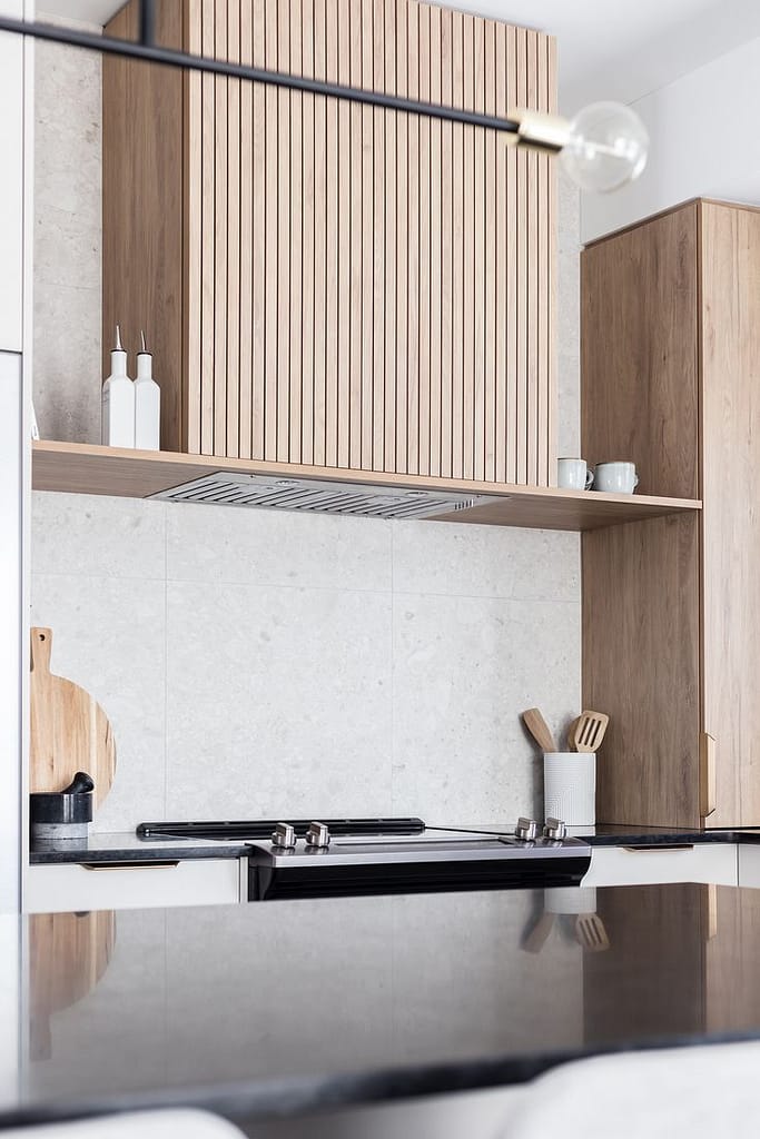 Layered kitchen lighting design with pendant lights and under-cabinet LEDs