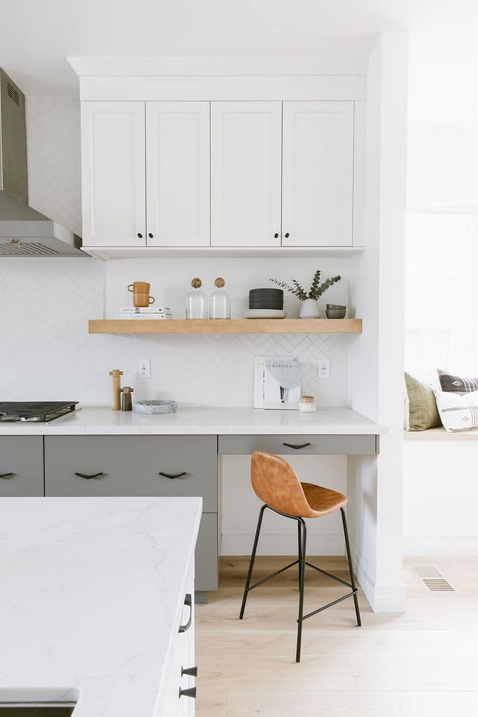 Close-up of a high-end Coquitlam kitchen with dark wood cabinets and a bright green vertical tile backsplash, demonstrating the quality required for final permit inspection and sign-off.