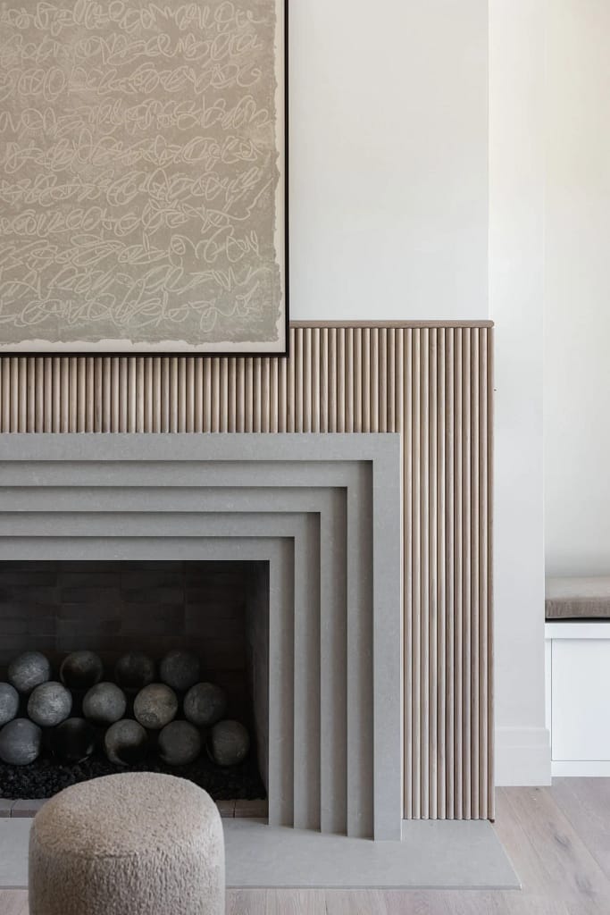 High-end home renovations in West Vancouver by Quay Construction, showcasing a modern open-concept living area with premium finishes and architectural lighting.