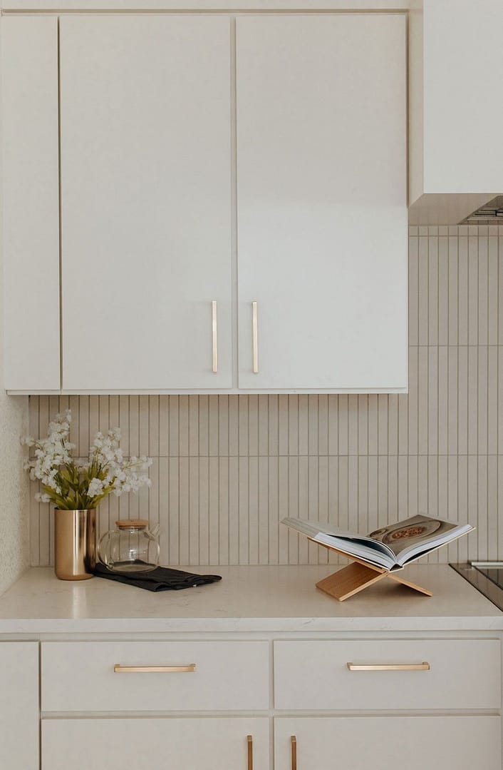 Vancouver condo kitchen renovation showing modern white cabinets and quartz countertops