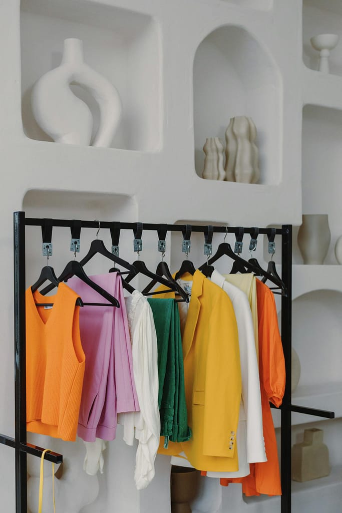 retail renovation with venetian plaster wall and clothing rack