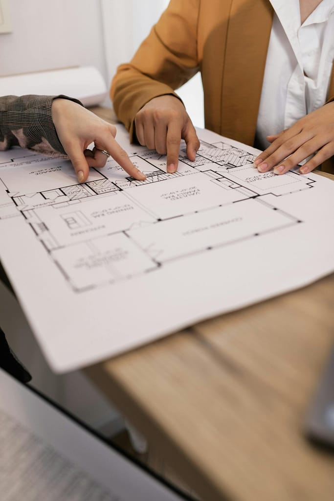 Vancouver contractor reviewing building plans for condo renovation project