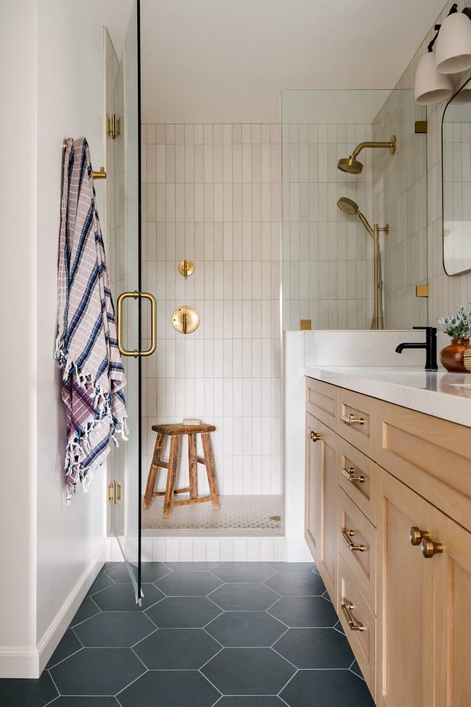 Luxury spa-inspired bathroom renovation in Coquitlam with walk-in shower, custom vanity, subway tiles, and heated floors by QUAY Construction