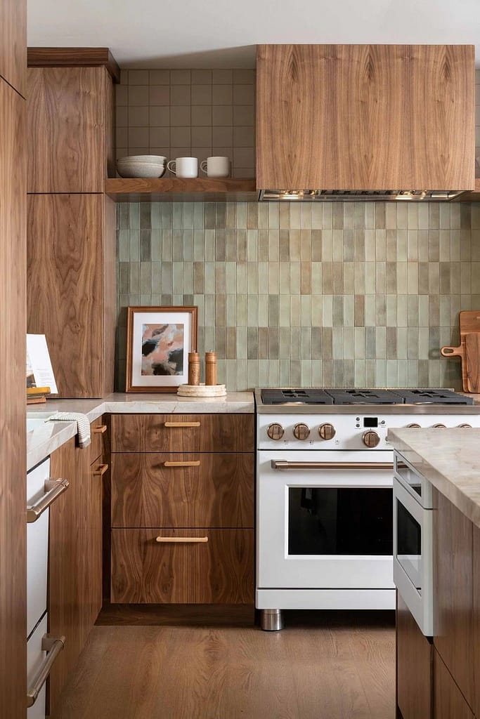 Wide view of a comprehensive Coquitlam kitchen renovation featuring two-toned cabinetry and built-in appliances, illustrating a project requiring a major building permit.