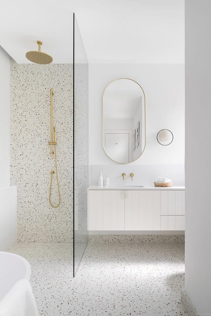 Spa-inspired bathroom renovation in Westwood Plateau with terrazzo stone and custom vanity by QUAY