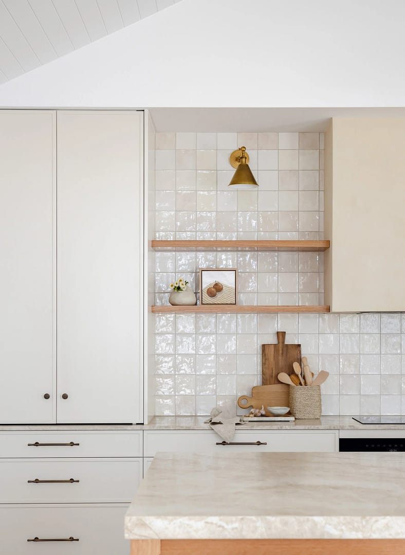 Custom white cabinetry and natural wood open shelving from a condo renovation in Burnaby by a professional condo renovation contractor.