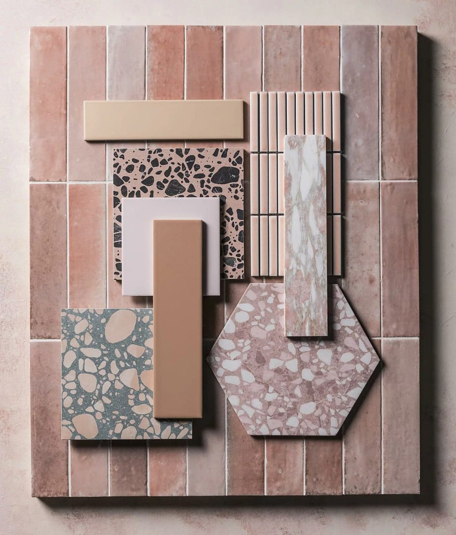 Material moodboard for a bathroom renovation in Burnaby featuring pink subway tiles and various terrazzo stone samples by Quay Construction.