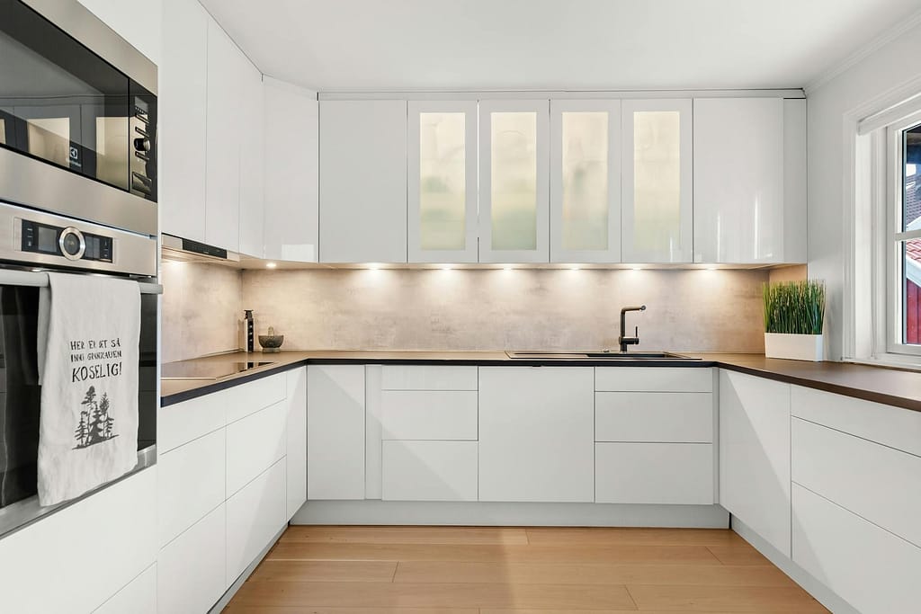 kitchen with white cabinets and black countertops