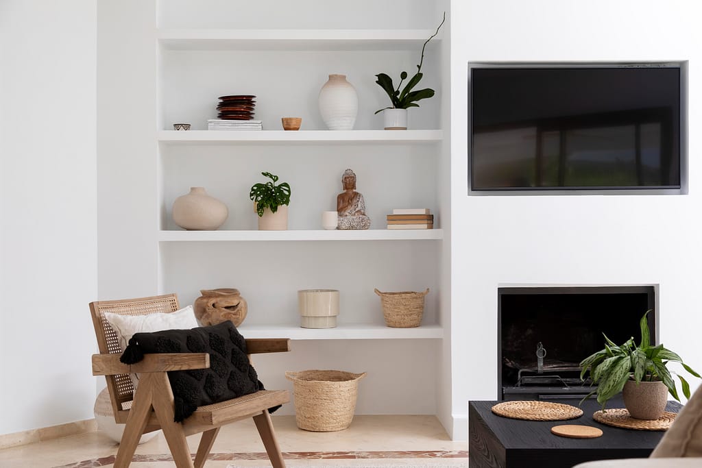 Vancouver Renovations featuring white built-in shelving with vases