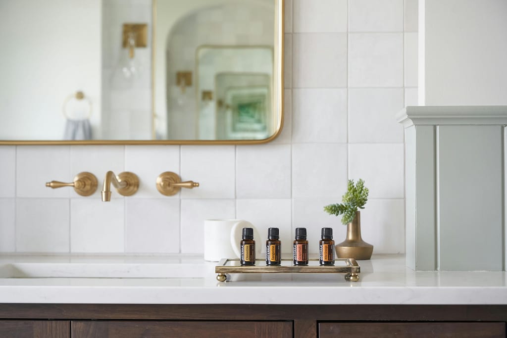 Bathroom renovation Richmond featuring gold wall-mount faucet