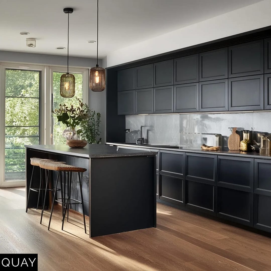 black kitchen cabinets and oak flooring