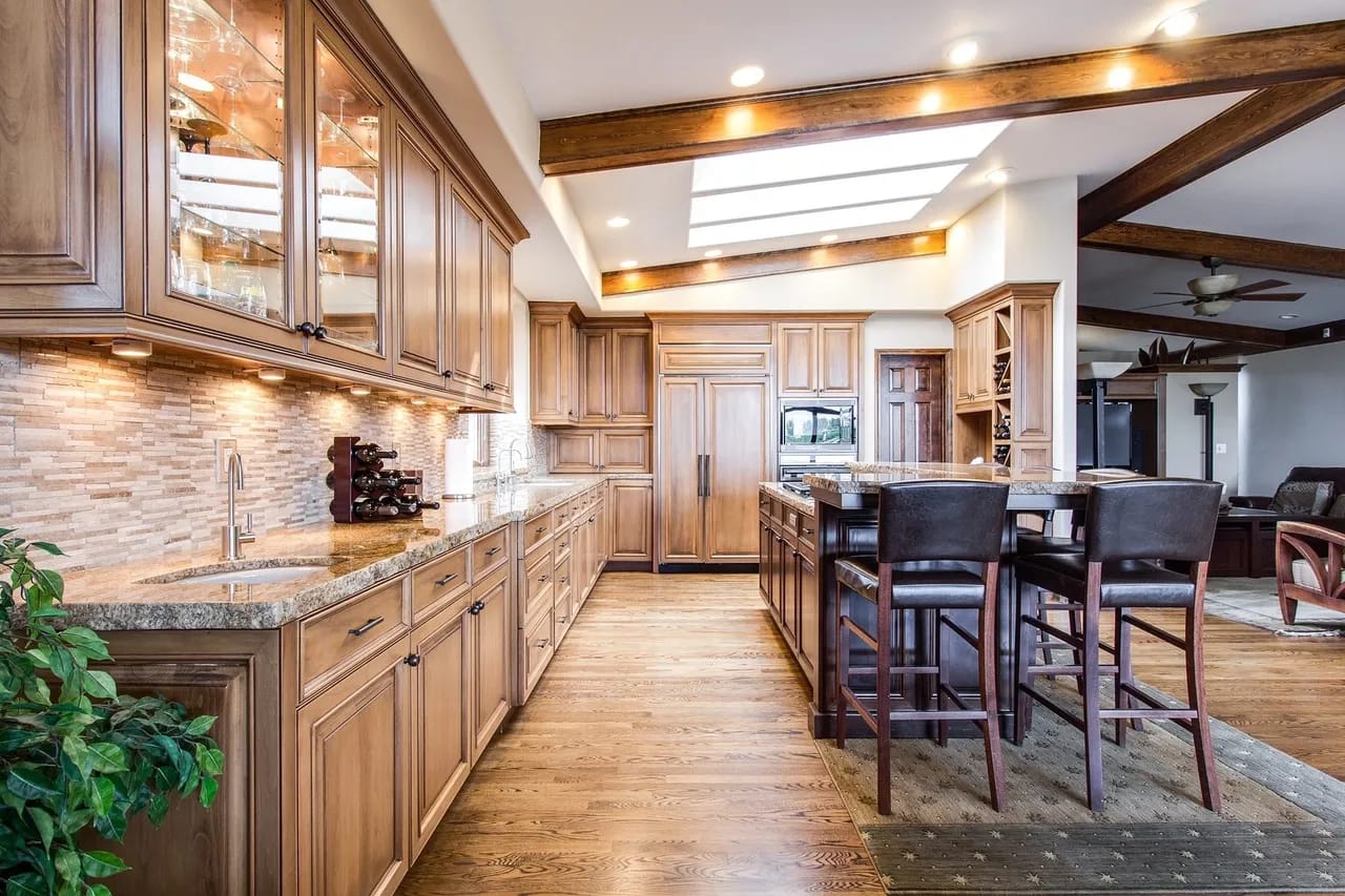 Traditional kitchen with hardwood flooring and stained cabinets