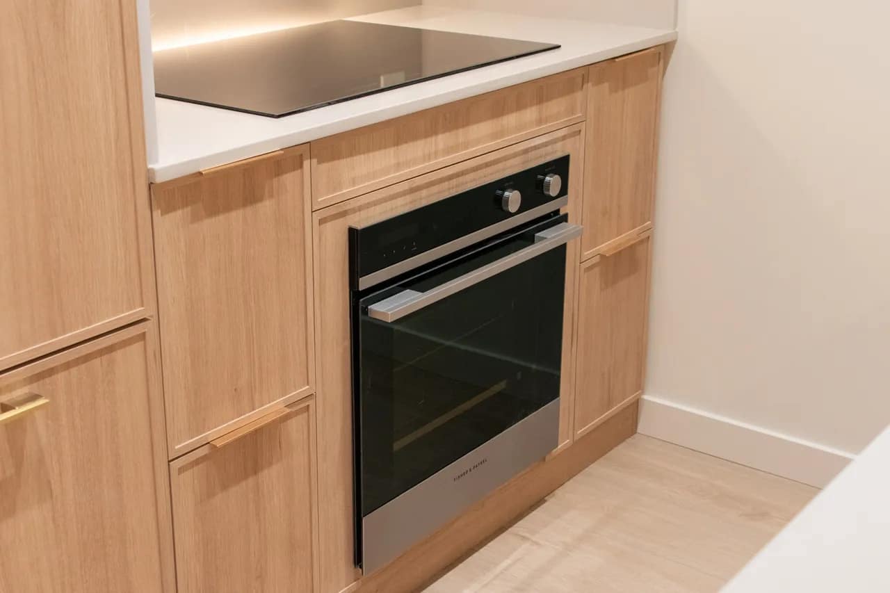 kitchen with oak cabinets and fisher and paykel appliances