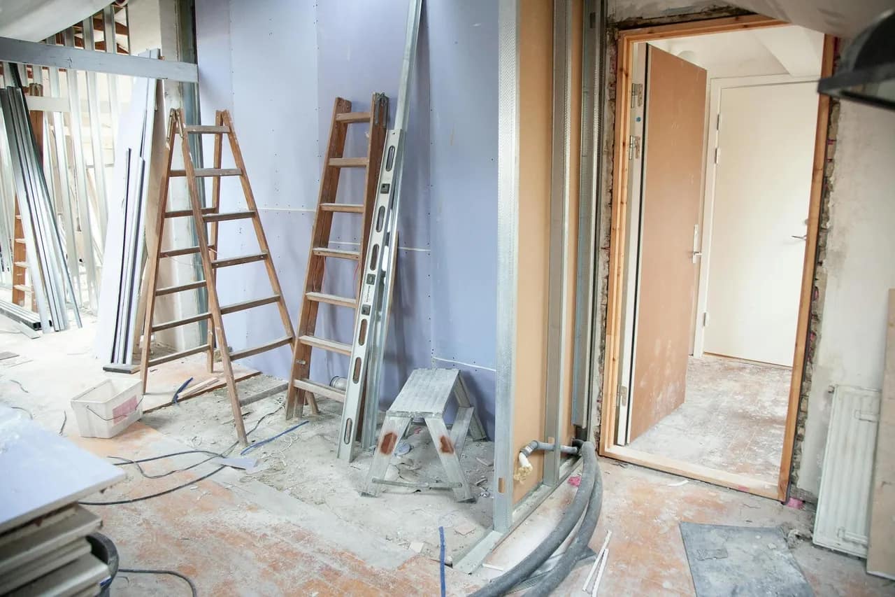 Ladders in a hallway of a house that’s in the process of renovation