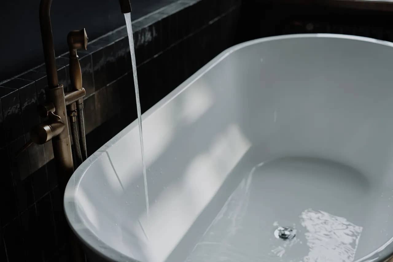 water filling a stand alone bathtub