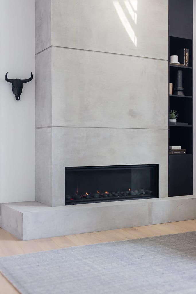 condo fireplace renovation feature custom concrete paneling