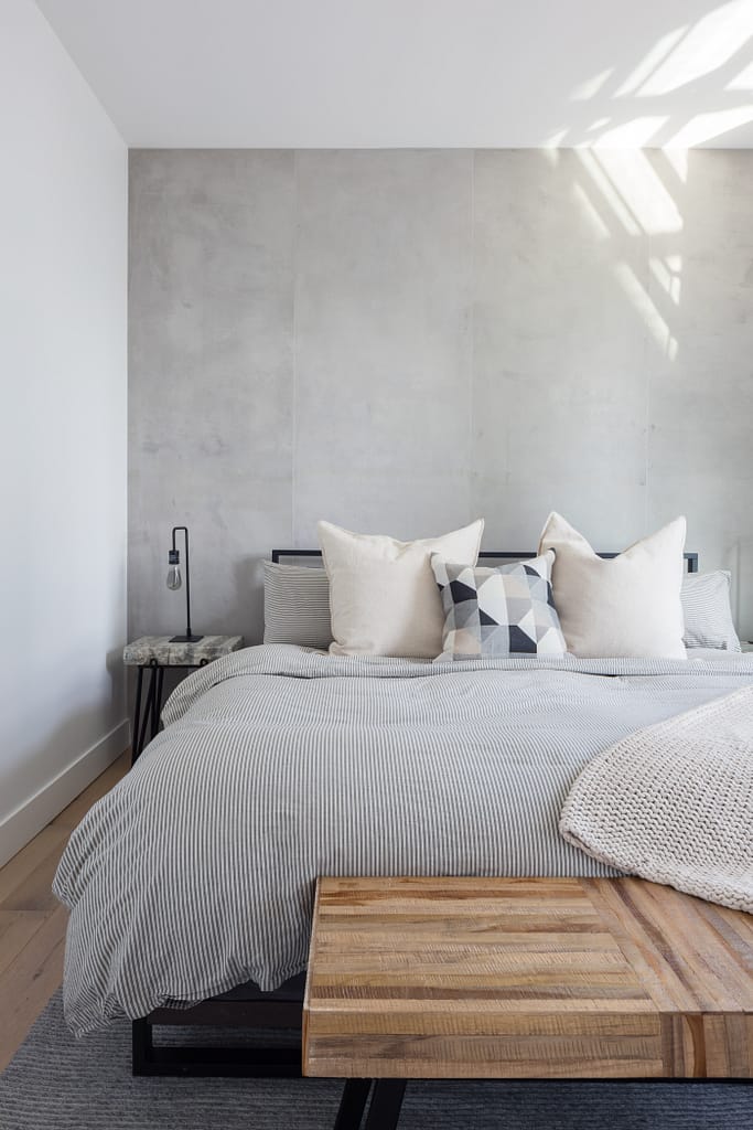 condo bedroom renovation with custom concrete wall panels