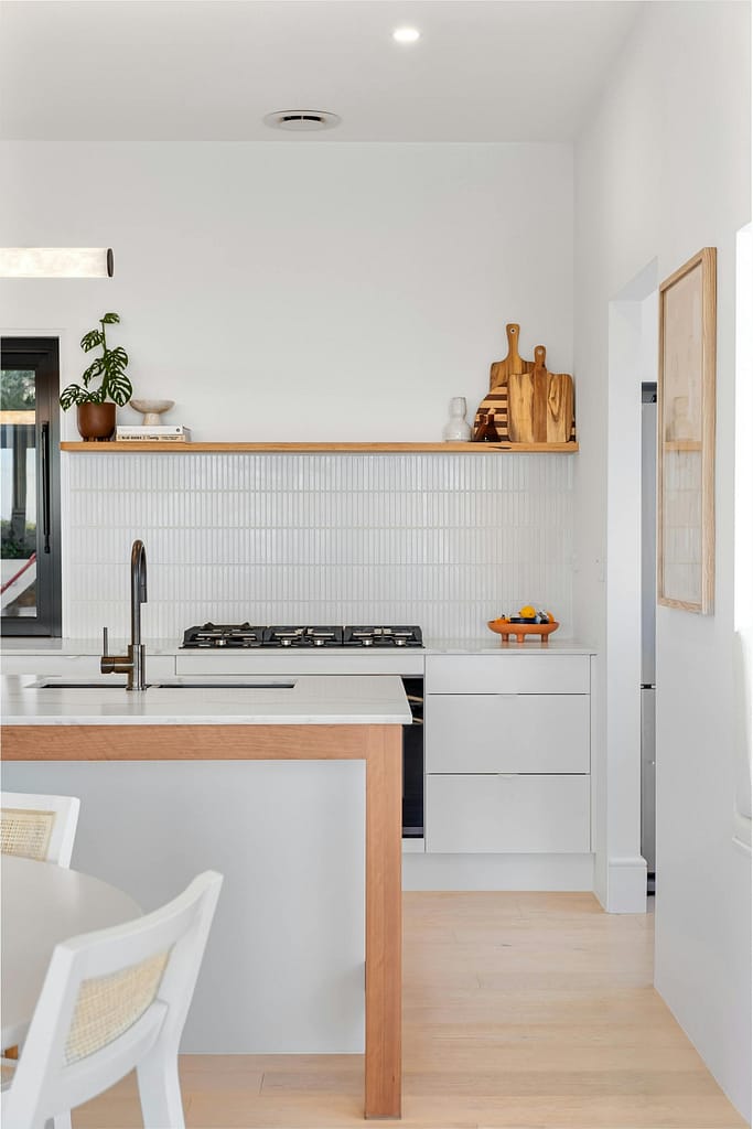 Kitchen Renovations featuring white and oak cabinets and white backsplashes