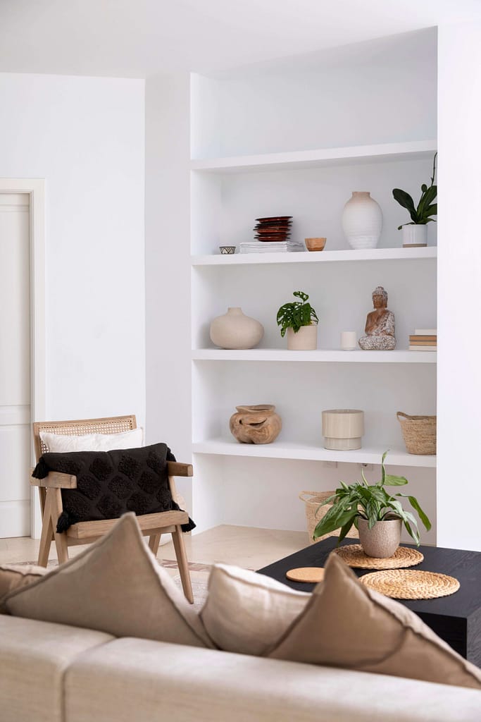 Vancouver Renovations featuring white built-in shelving with vases